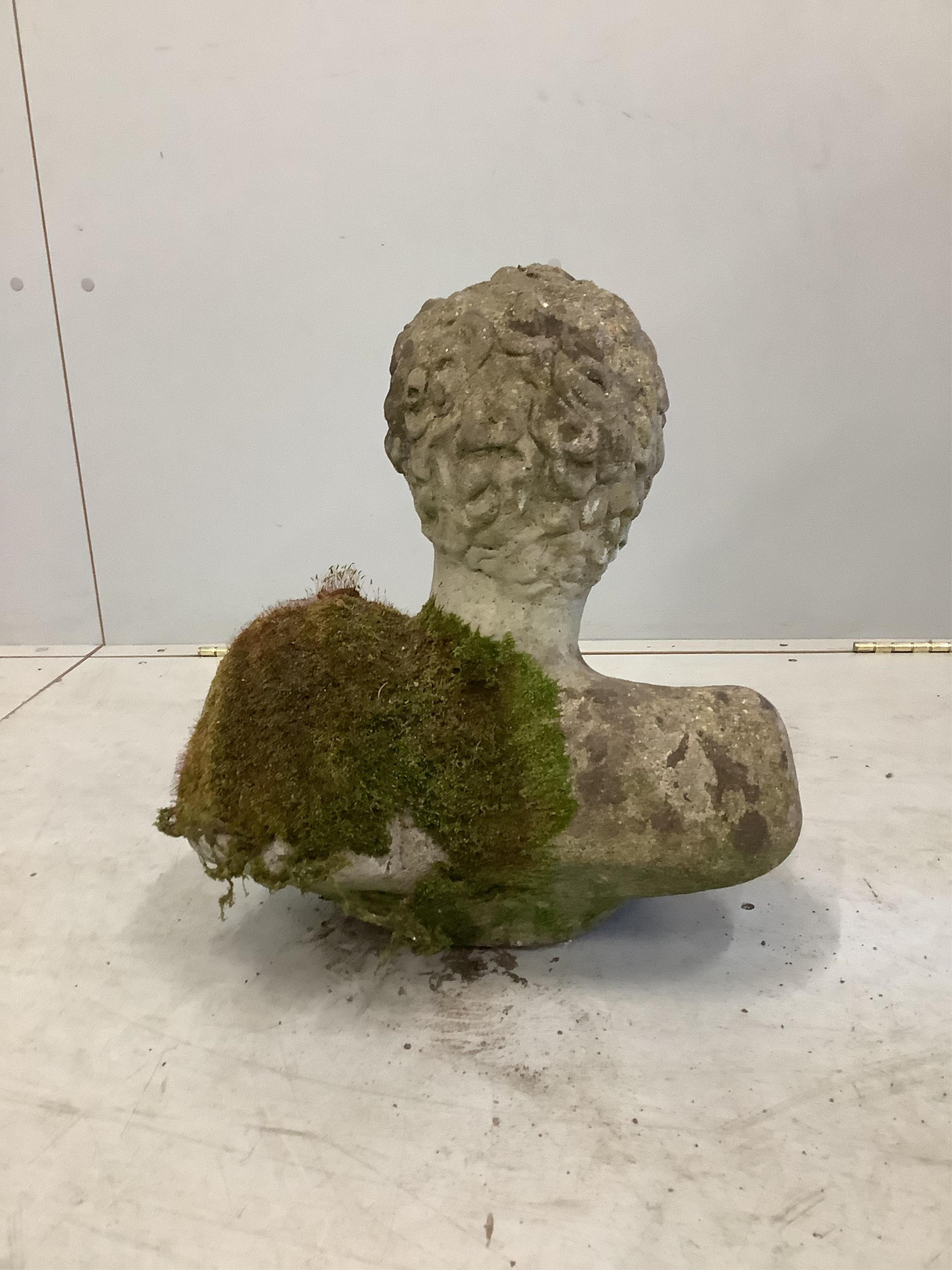 A weathered reconstituted stone garden ornament, height 42cm. Condition - fair